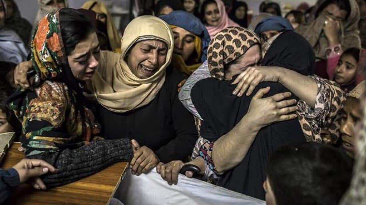 Women mourn the death of a relative killed during the attack on APS, Peshawar