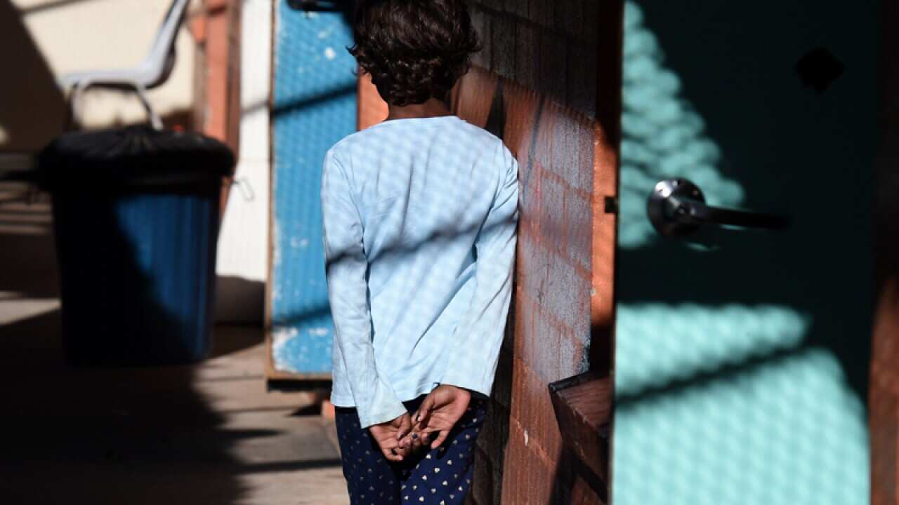 A child is seen at a women's shelter in Alice Springs