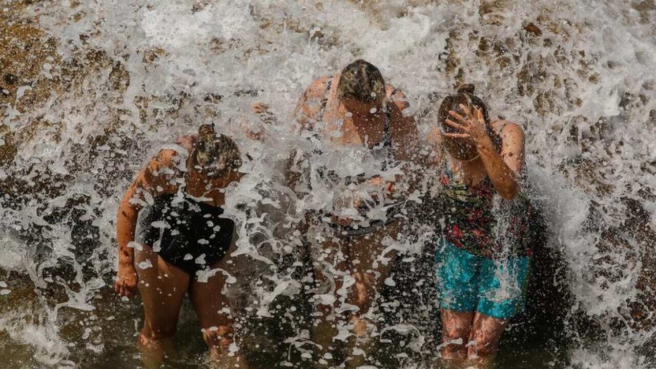 Beachgoers cooling off on Tamarama Beach in Sydney