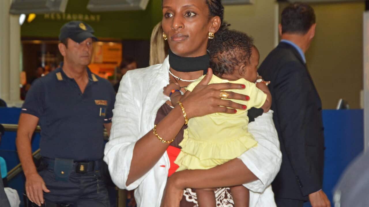 Meriam Ibrahim, from Sudan, with her daughter Maya in her arms leaves to Philadelphia (USA) from Rome (AAP)