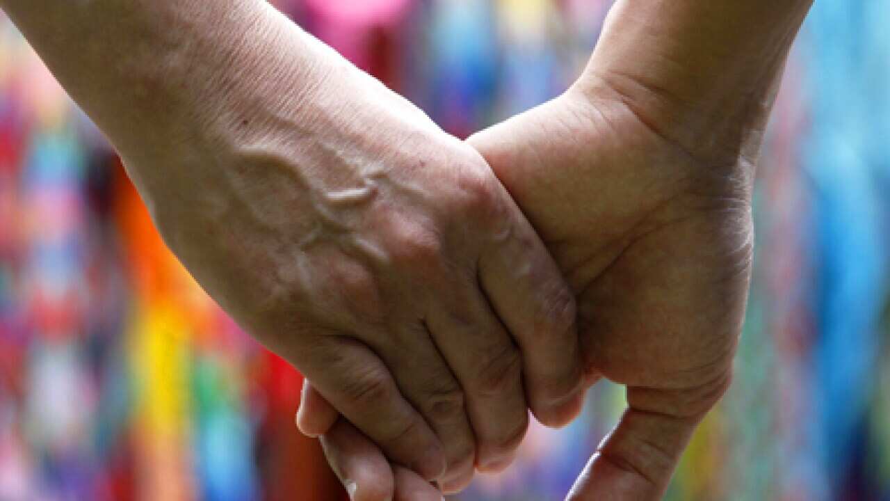 Couple holding hands