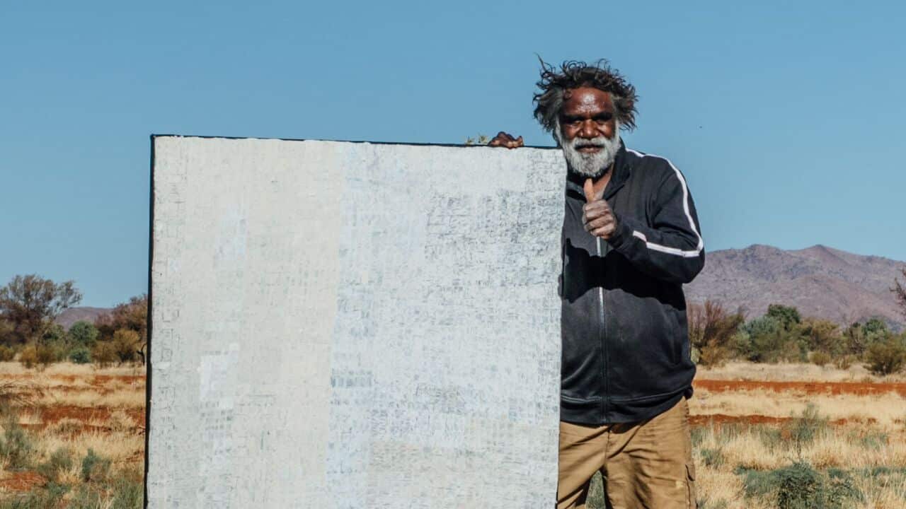 A supplied image obtained on Friday, July 19, 2019, of indigenous artist Carbiene McDonald Tjangala who was on Friday announced as the winner of the $100,000 Hadley's Art Prize in Hobart. (AAP Image/Supplied) NO ARCHIVING, EDITORIAL USE ONLY