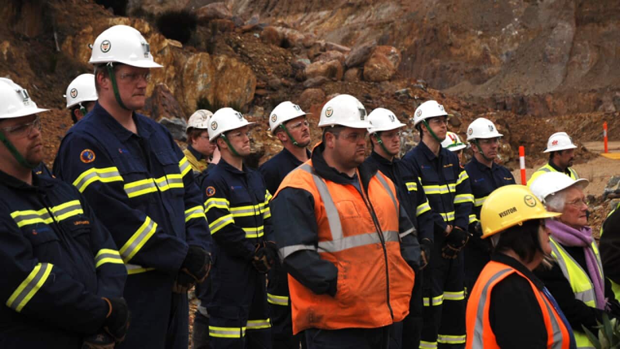 Miners attend a ceremony for the centenary of the Mt Lyell disaster