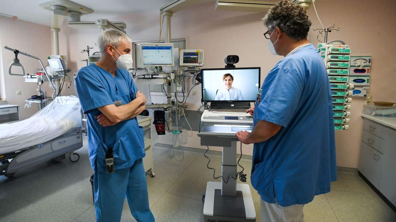 Doctors consult via telehealth.