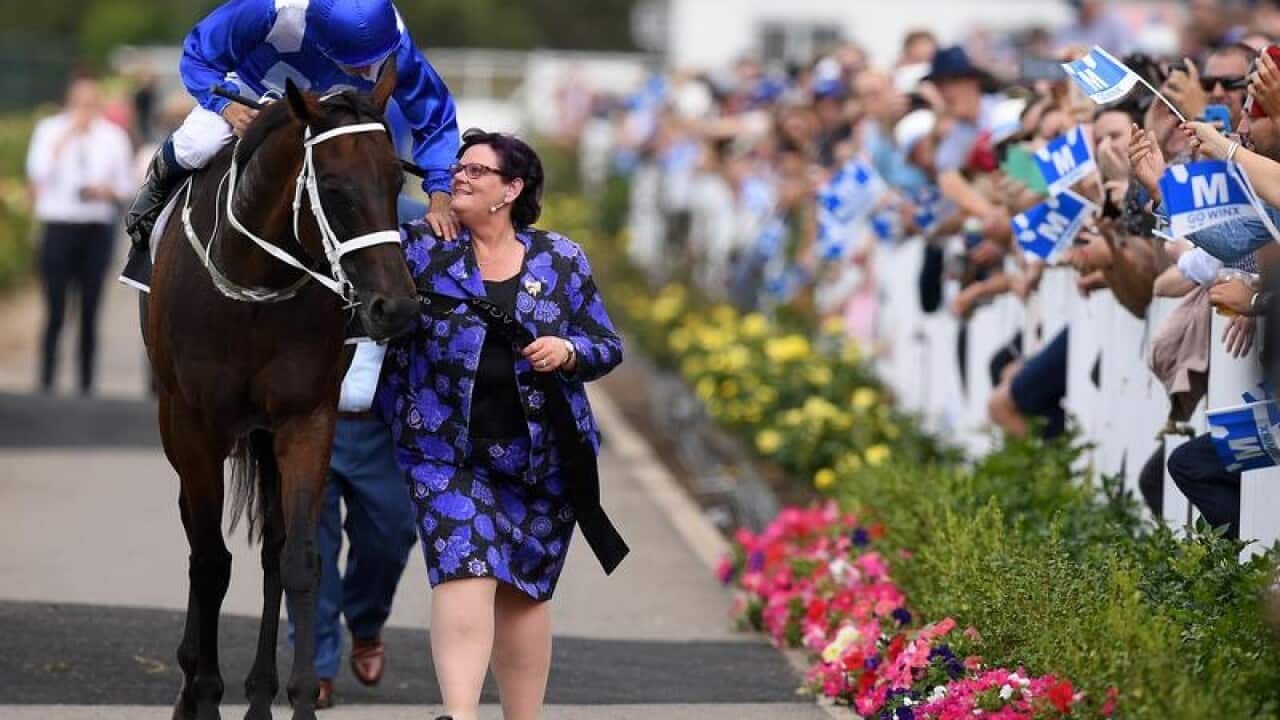 Winx, with jockey Hugh Bowman and owner Debbie Kepitis, after a win.