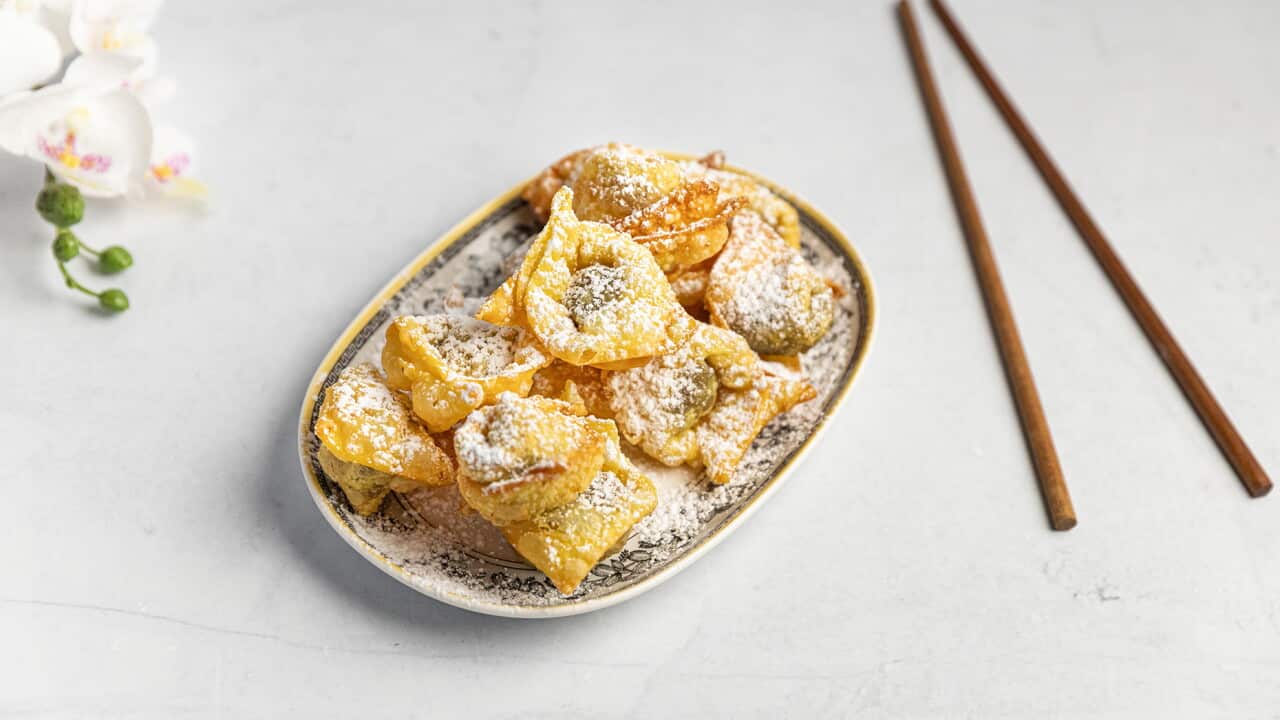 Fried chocolate dumplings dustted with icing sugar
