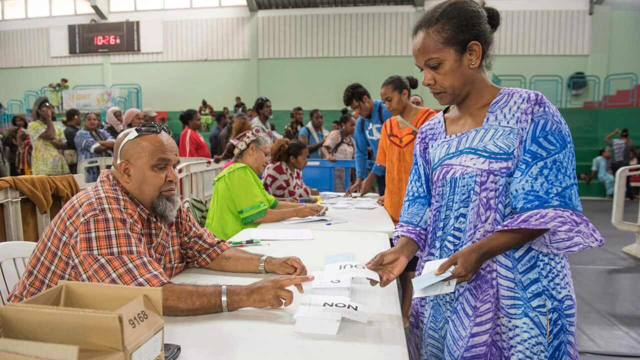 A woman participates in last year's independence referendum in New Caledonia