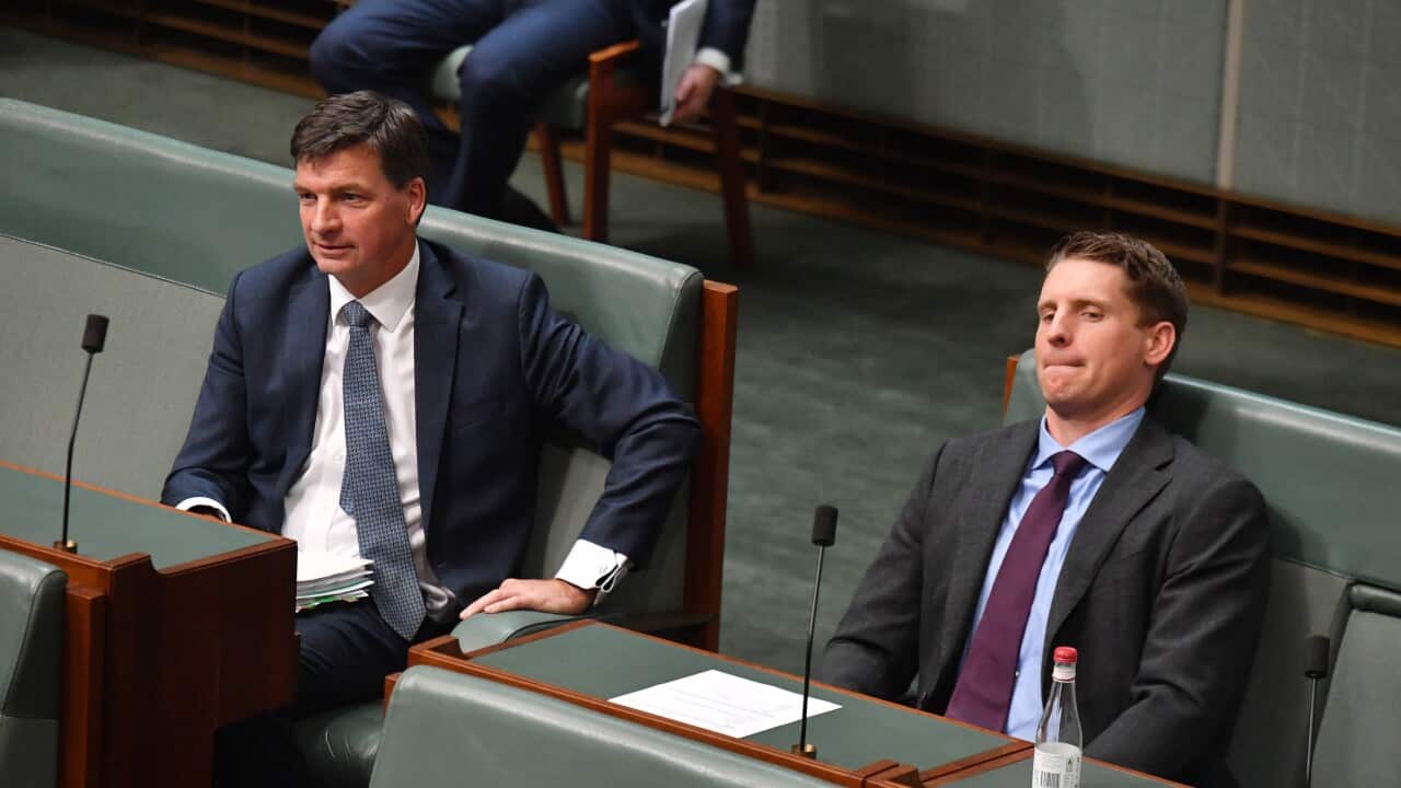 Two men sitting in parliament