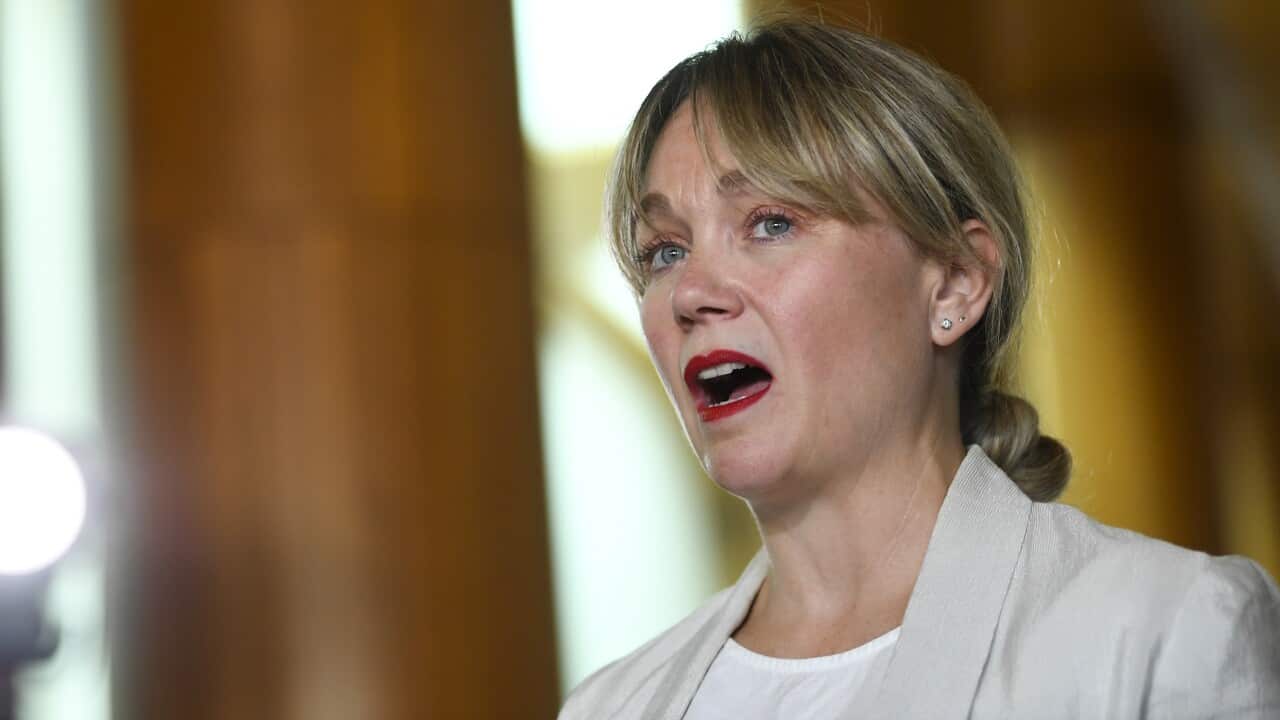 A woman in a white jacket