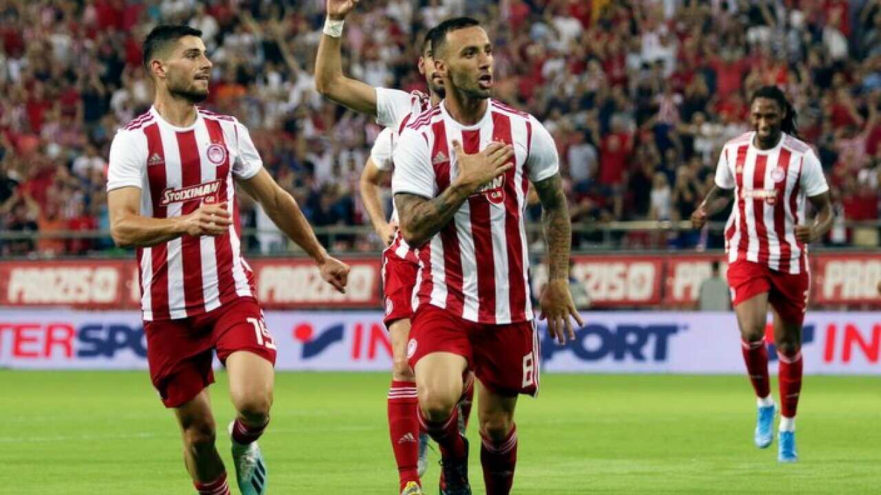 Guilherme (C) celebrates scoring the 1-0 during the UEFA Champions League second qualifying round leg 2 soccer match between Olympiacos and Victoria Plzen.