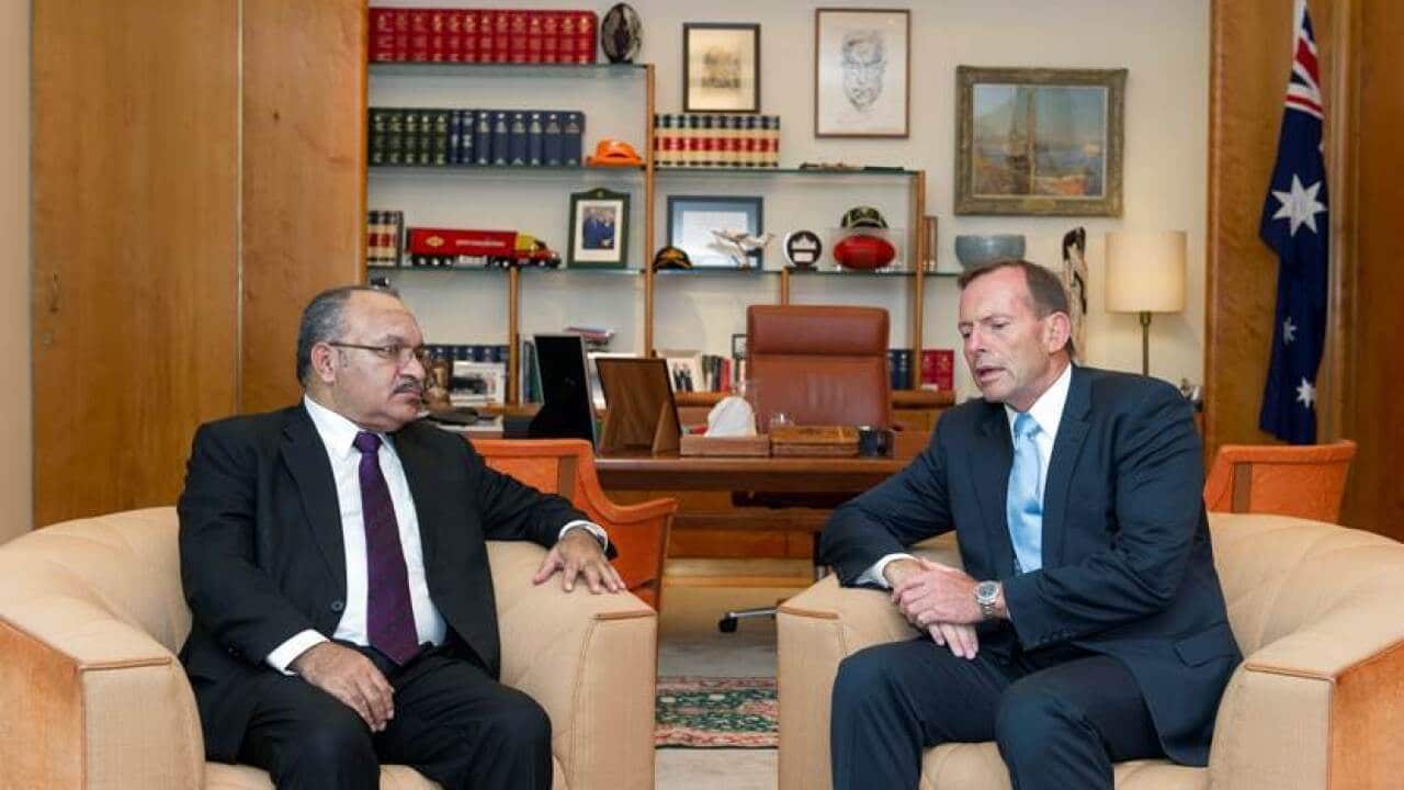 Australian Prime Minister Tony Abbott (right) meets with Papua New Guinea's Prime Minister Peter O'Neill in Canberra to discuss the continued issues on Manus Island. (AAP)
