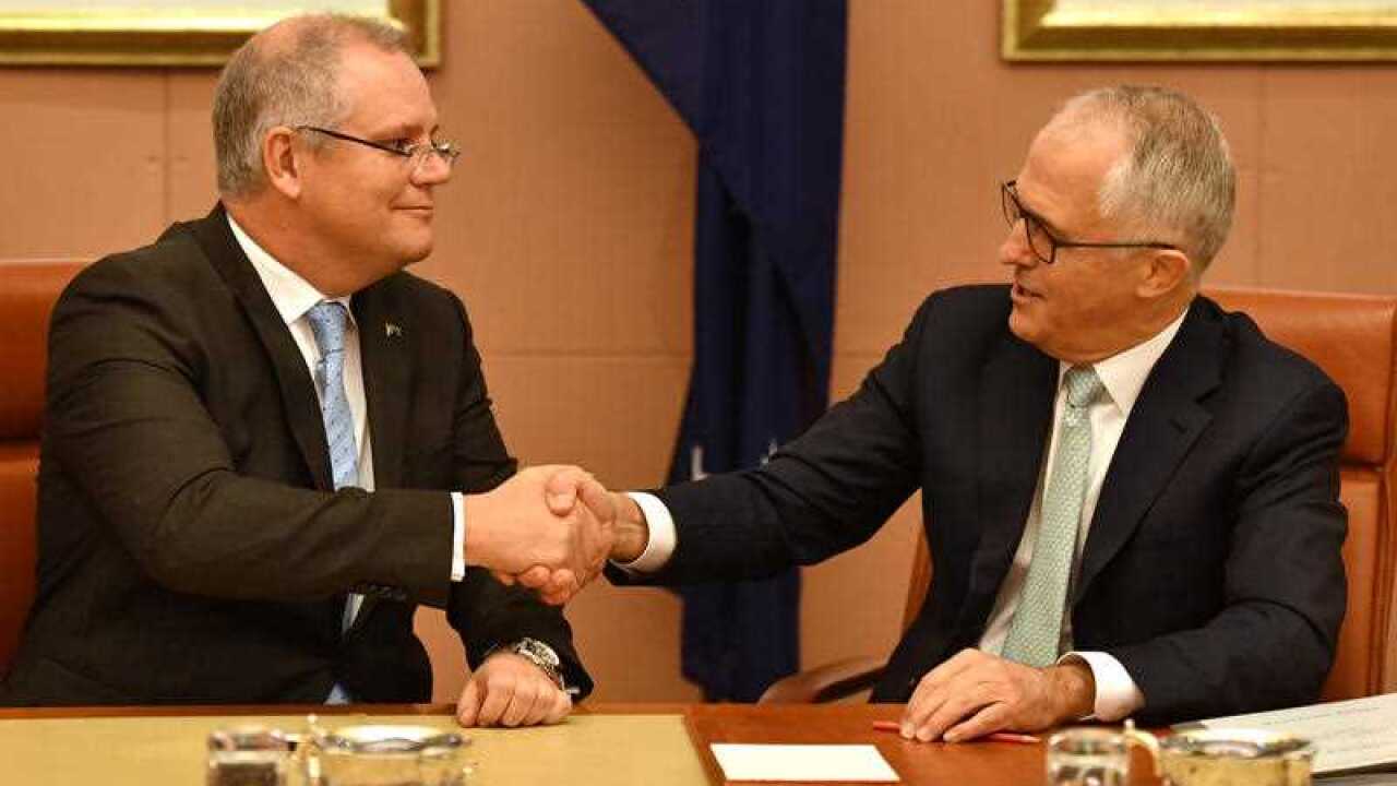 Treasurer Scott Morrison and Prime Minister Malcolm Turnbull shake hands