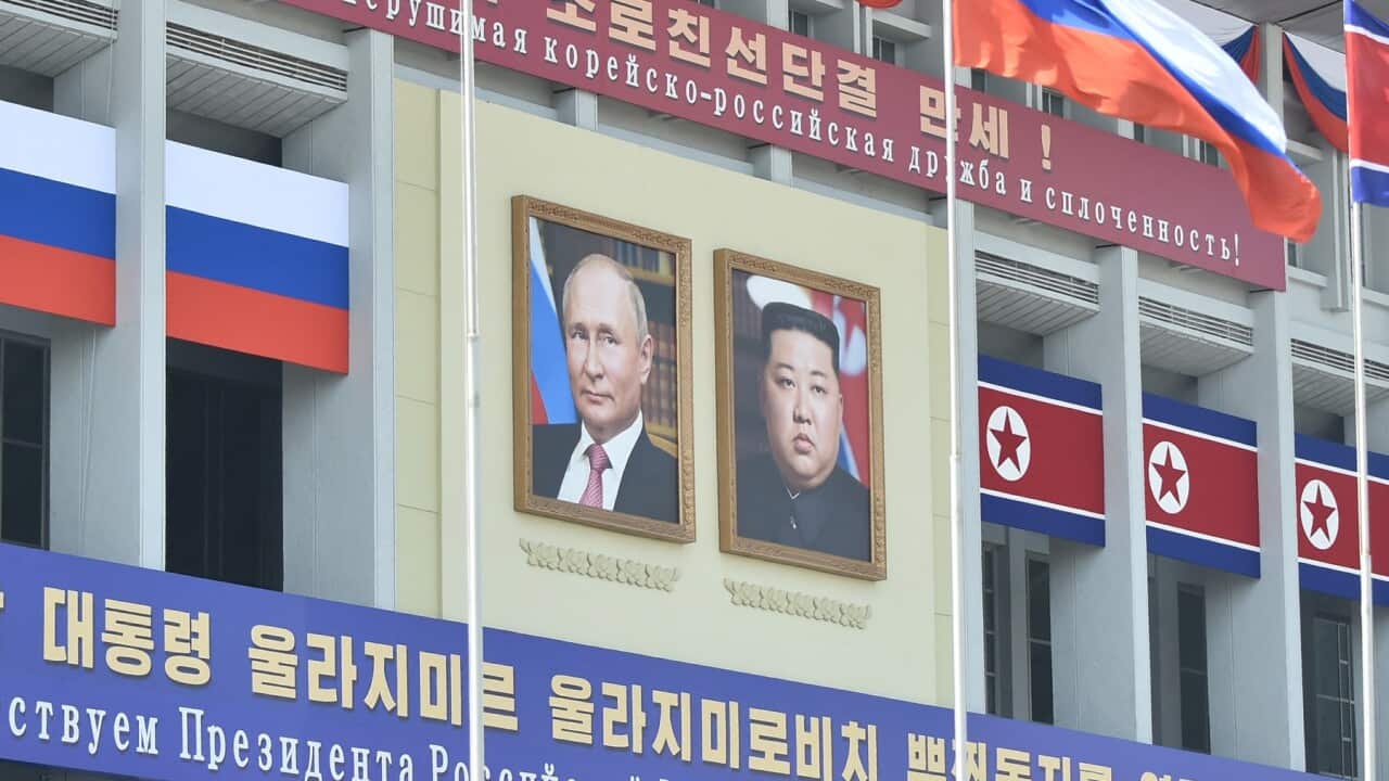 Portraits of Russian President Vladimir Putin (L) and North Korea's leader Kim Jong Un in Pyongyang (Getty) .jpg