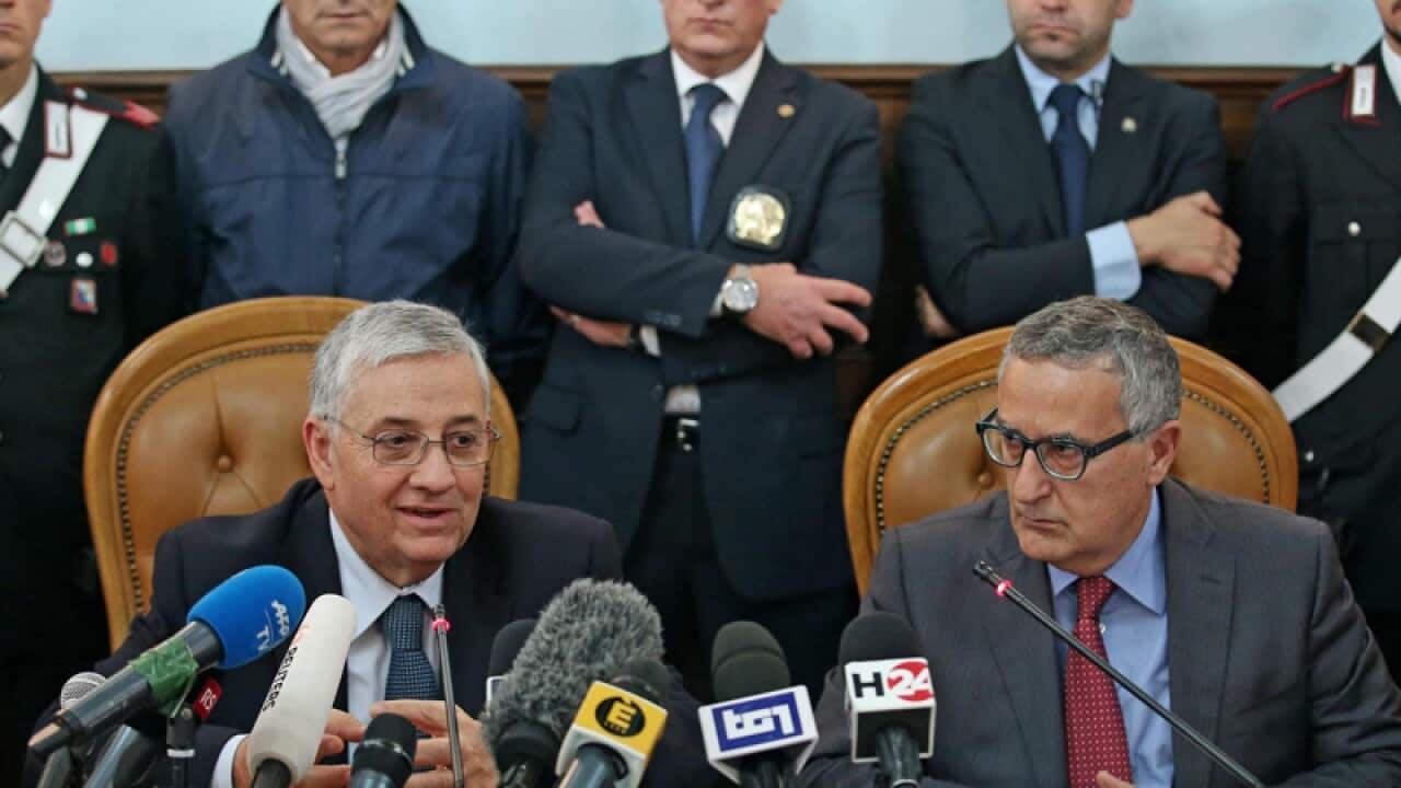 Italian authorities following an anti-terror operation