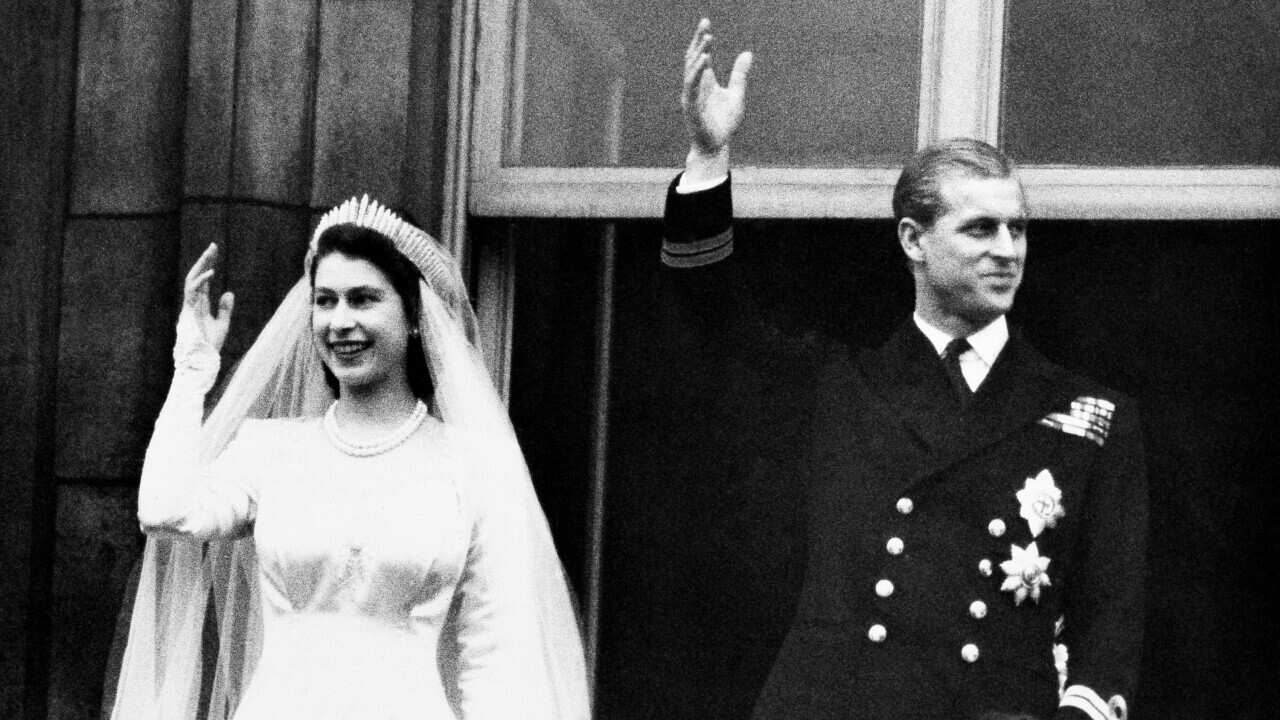 Princess Elizabeth and Prince Philip wave from the balcony of Buckingham Palace, London, on their wedding day in 1947.