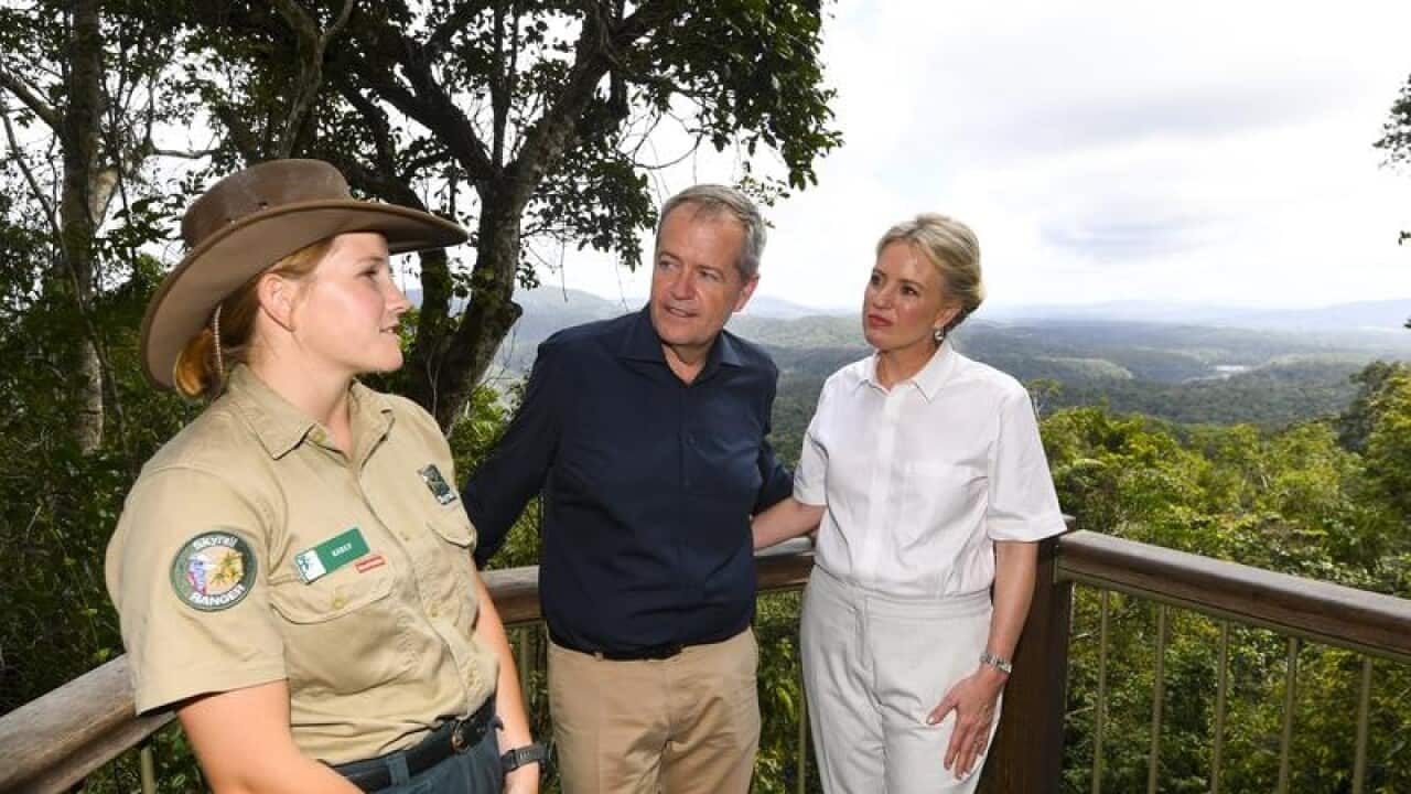 Bill Shorten and his wife Chloe speak to a ranger in Cairns