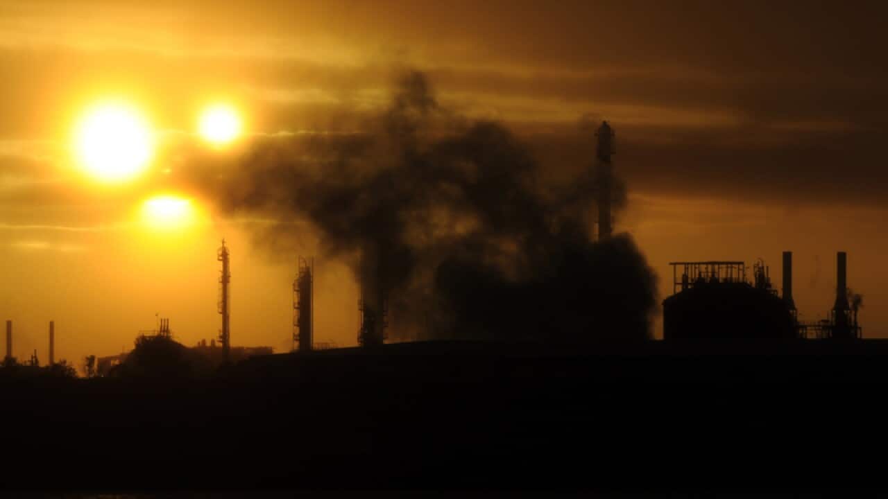 Steam and other emissions rise from an industrial plant in Melbourne