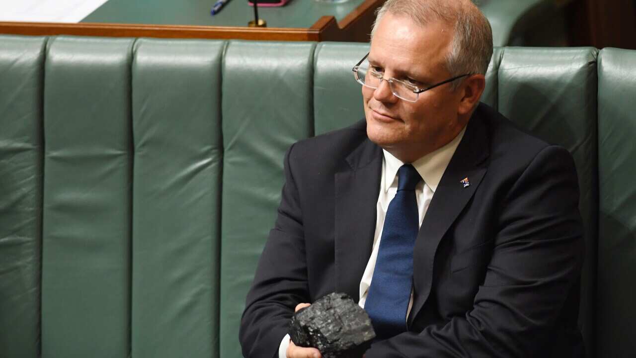 Then-treasurer Scott Morrison holding a piece of coal during House of Representatives Question Time at Parliament House in Canberra, Thursday, Feb. 9, 2017.