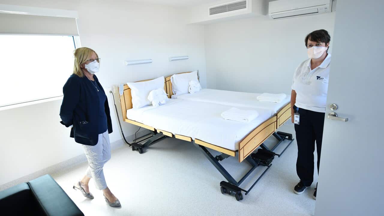 Victorian Police Minister Lisa Neville (left) tours the newly constructed Victorian quarantine accommodation hub in Mickleham, Melbourne, Saturday, February 19, 2022. (AAP Image/James Ross) NO ARCHIVING