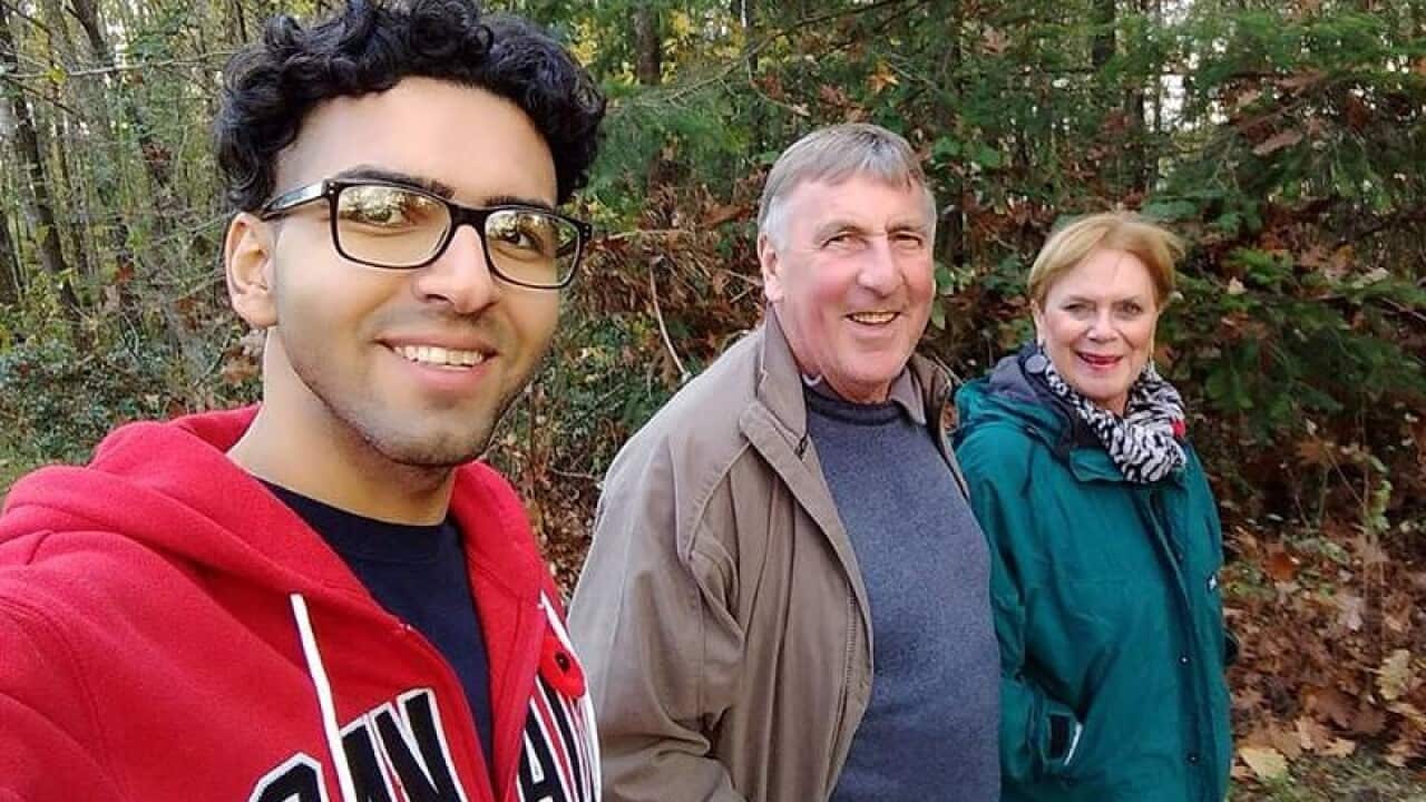 Iranian man Amir Taghinia with the Taylor family in Coquitlam