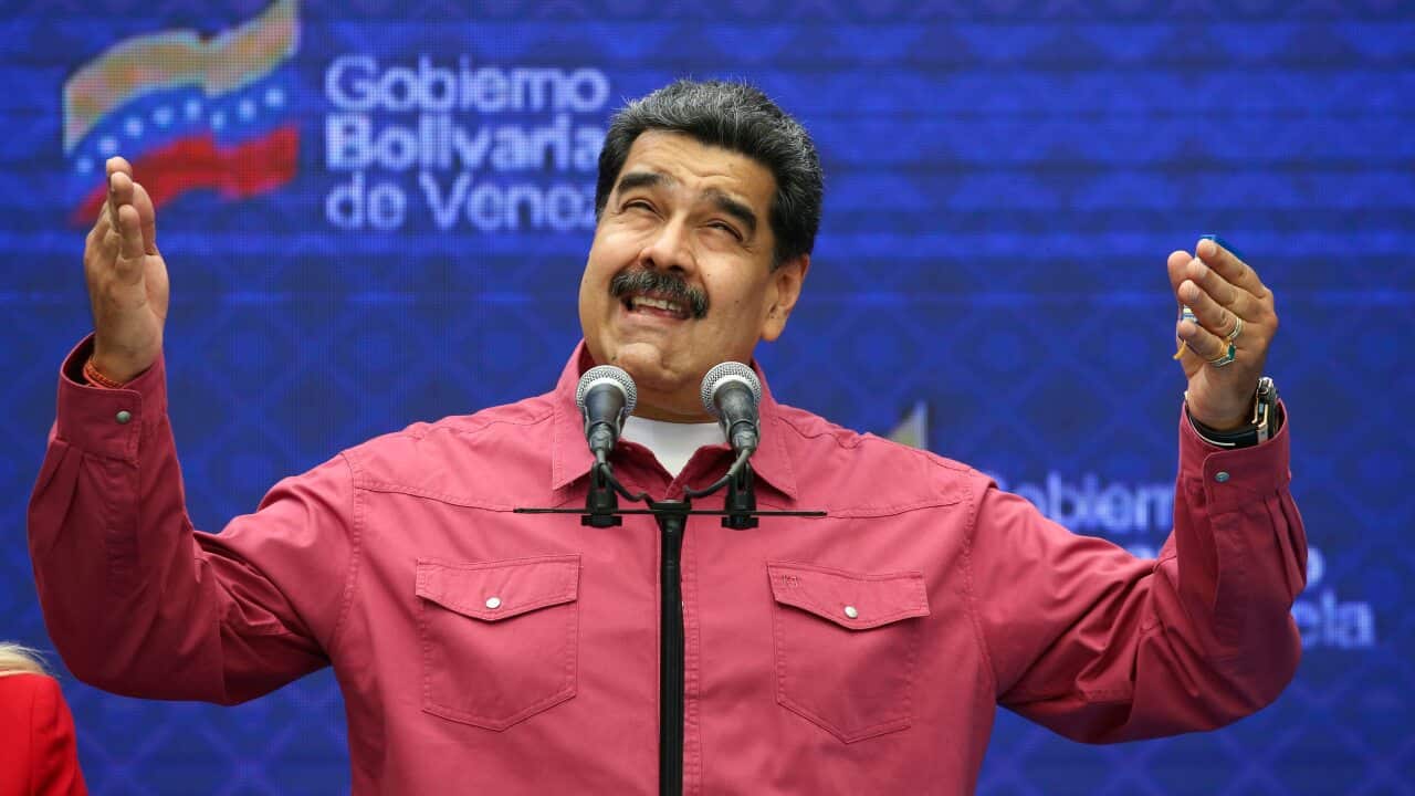 Venezuela's President Nicolas Maduro talks to journalist covering his vote in elections.