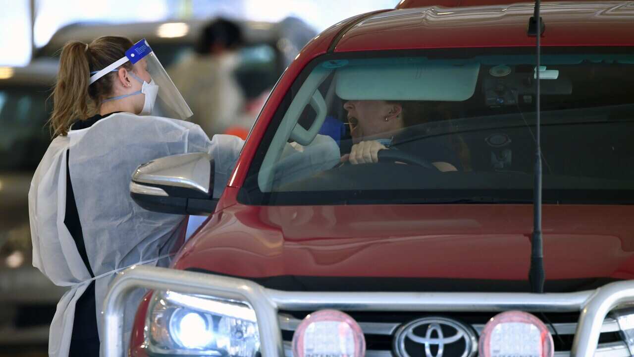 A healthcare worker conducts a Covid19 test at a Covid19 testing facility in Ballarat, Thursday, September 16, 2021