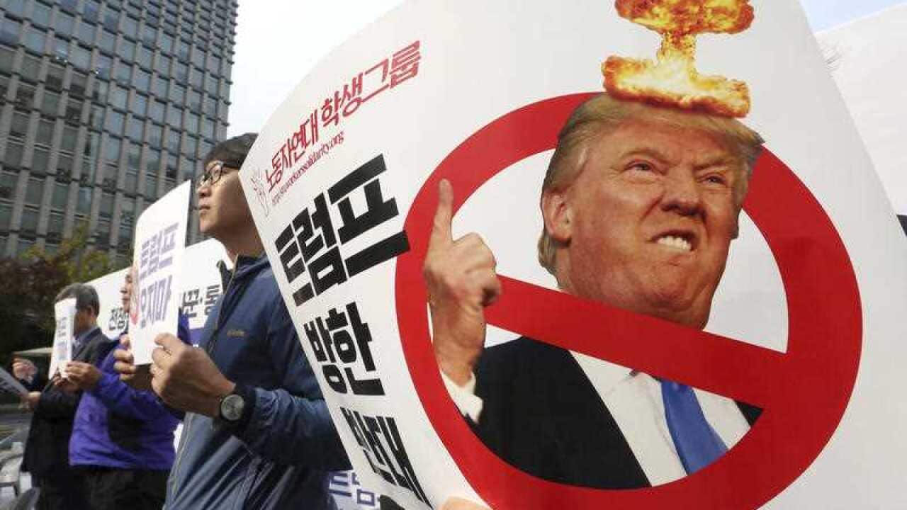 South Korean protesters stage a rally against a planned visit by U.S. President Donald Trump near U.S. Embassy in Seoul, South Korea, Wednesday, Nov. 1, 2017.
