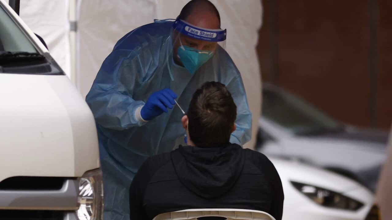 A person is given a COVID test at a pop-up COVID test site in Melbourne