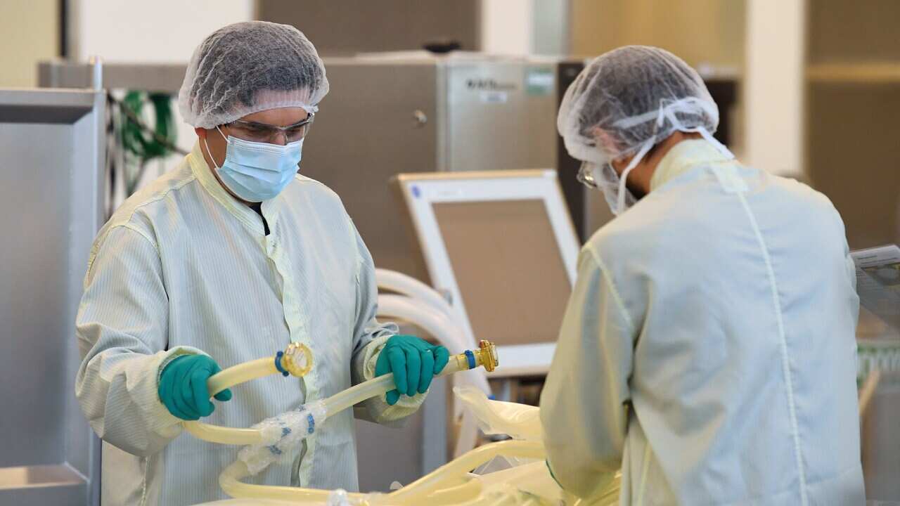 Scientists are seen at work inside of the CSL Biotech facility in Melbourne.
