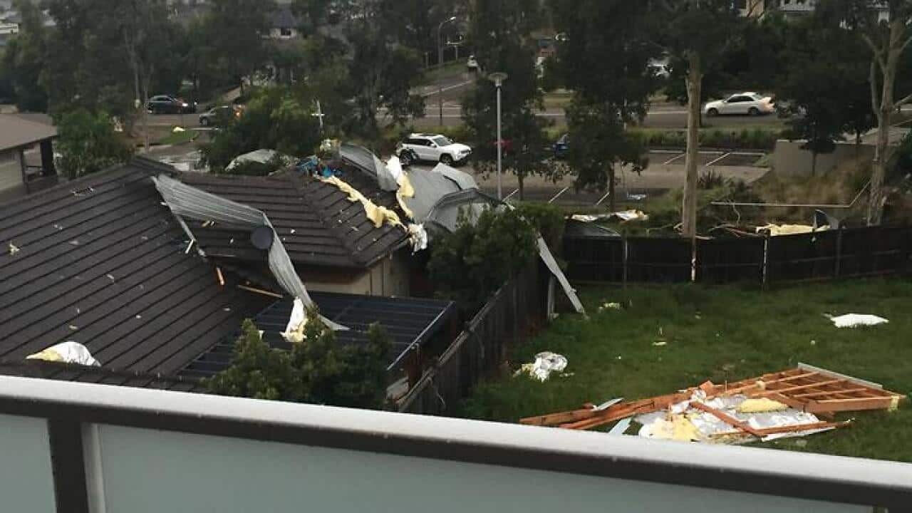 Roof of apartment building in Moorebank blown off onto neighbouring house and streets. Thursday, Jan 14, 2016. (AAP)