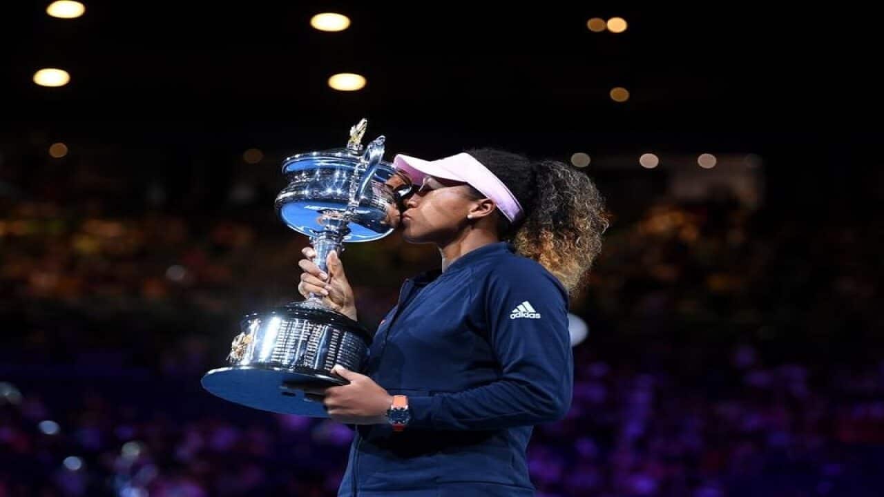 Naomi Osaka of Japan during the presentation of the winner's trophy,