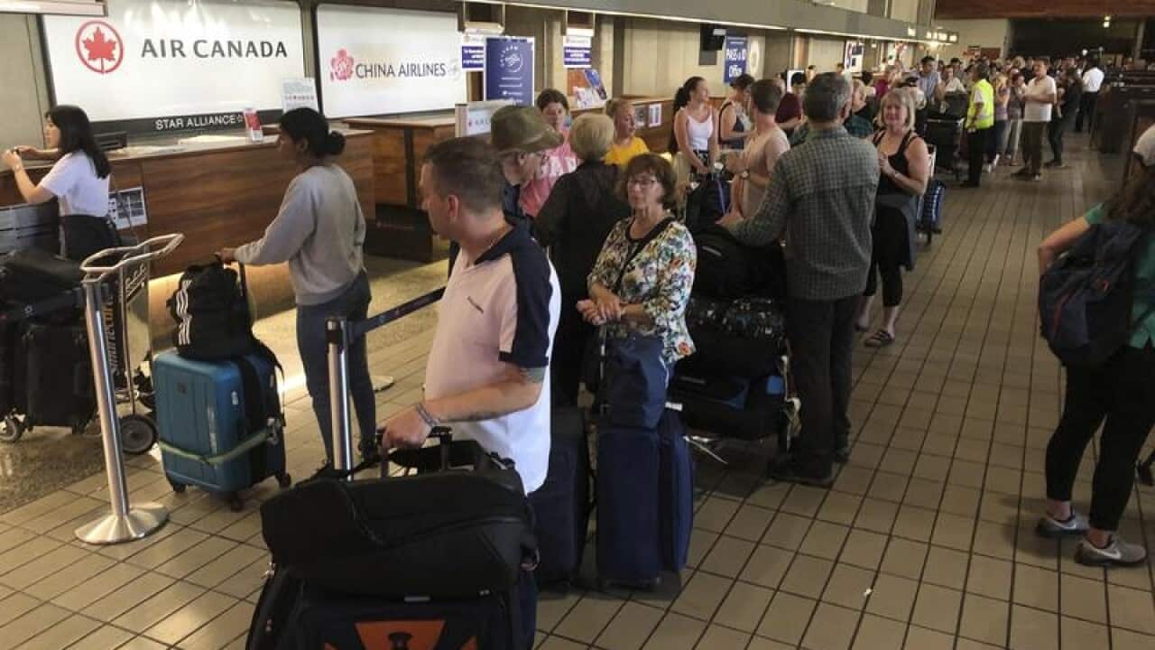 Passengers from a Sydney-bound Air Canada flight in Honolulu.