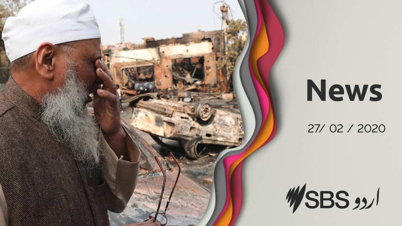 An Indian man cries during violence in New Delhi.