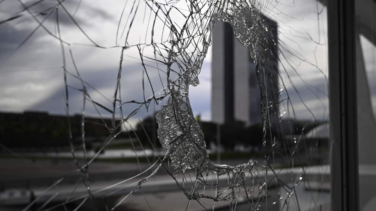 A broke window at Planalto Palace, in Brasilia, Brazil (Getty)