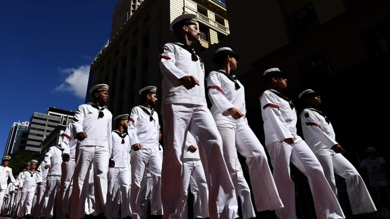 Defence forces veterans march through central Brisbane
