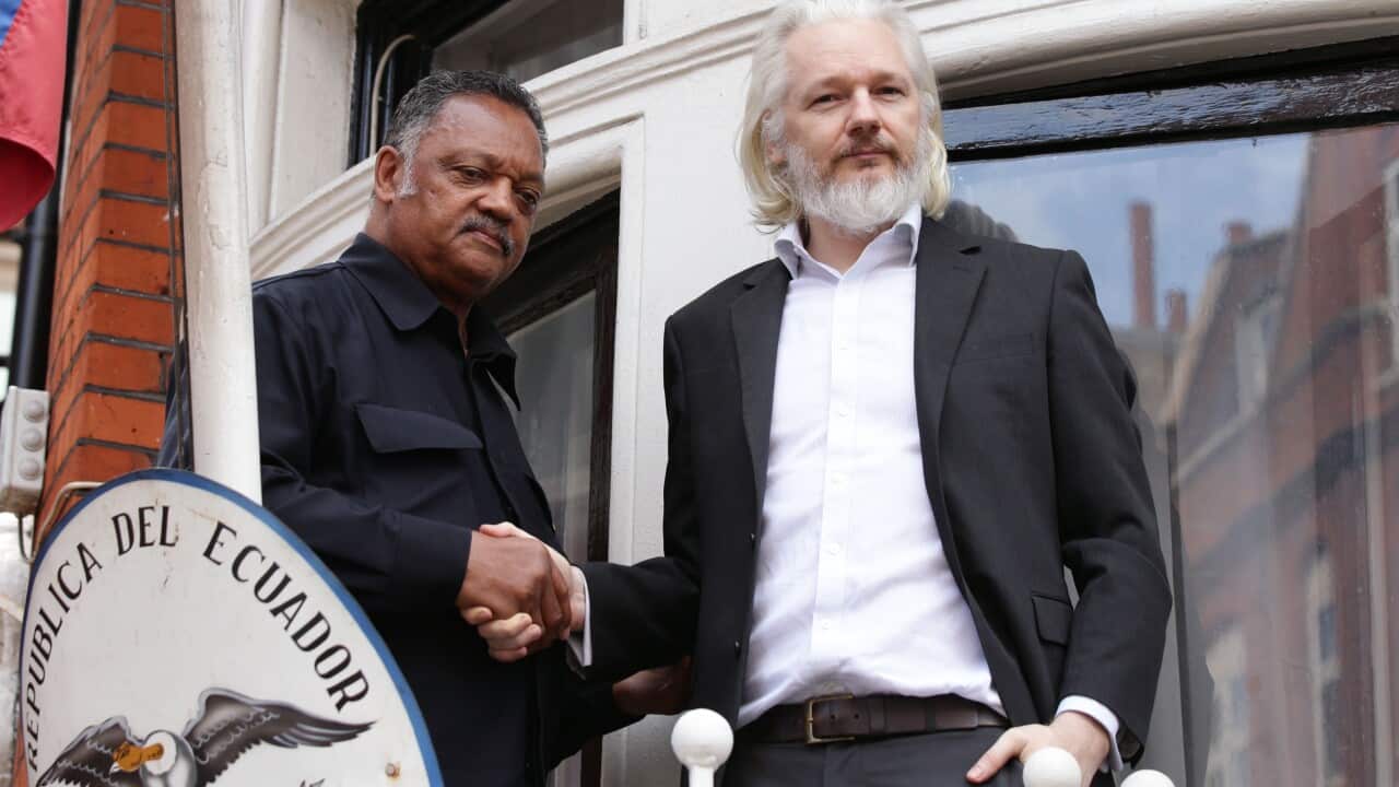 WikiLeaks founder Julian Assange with Reverend Jesse Jackson outside the Embassy of Ecuador in London (AAP)