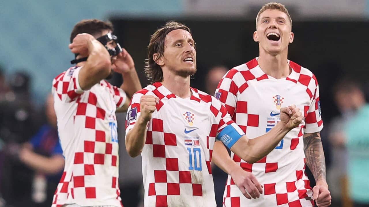 Luka Modric celebrates Croatia's win with his teammates