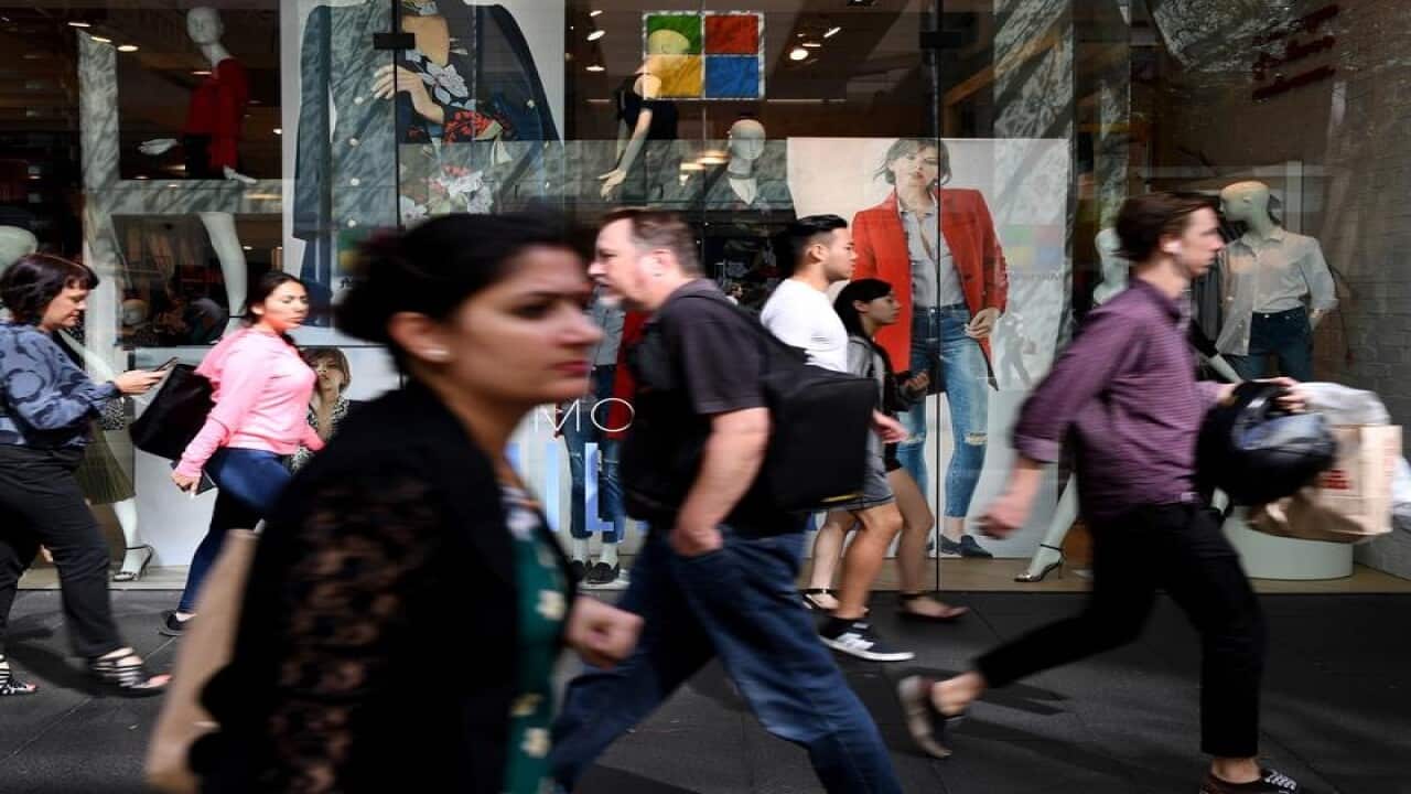 People are seen at Pitt Street mall in Sydney.