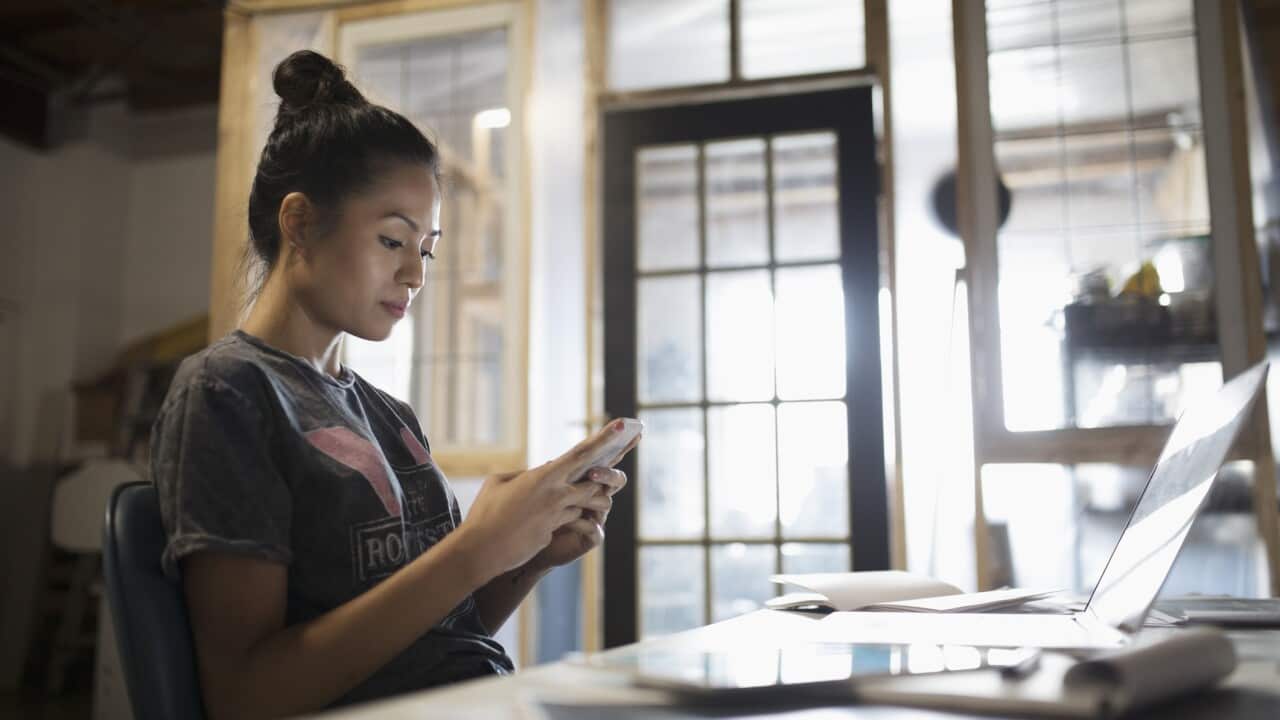 A woman checking her emails