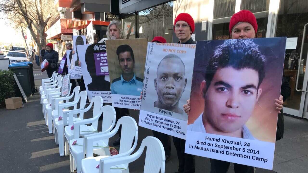 A protest outside Bill Shorten's Moonee Ponds office showing 12 chairs in a row to remember the 12 people who've died in detention centres.