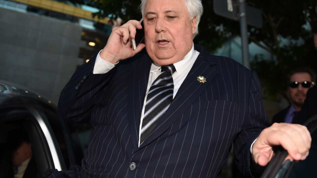 Businessman Clive Palmer leaves the Federal Court in Brisbane