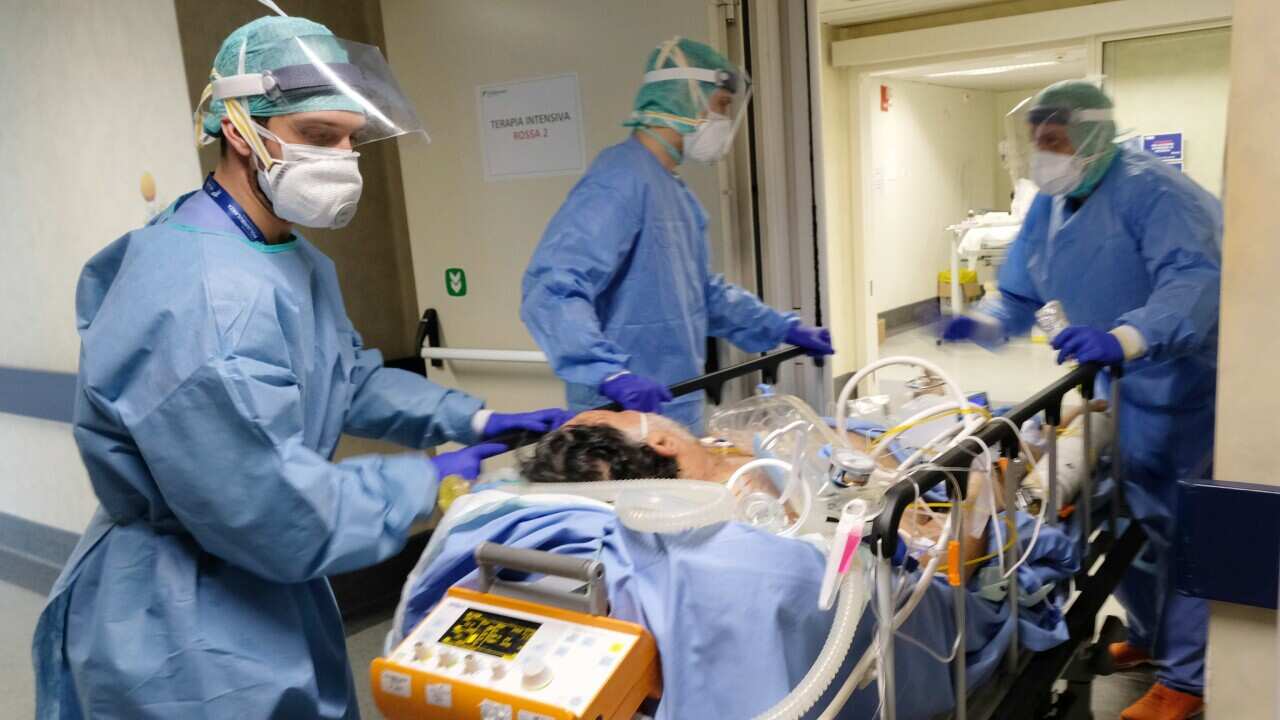 Healthcare professionals take care of Coronavirus sufferers in the intensive care of the Poliambulanza hospital in Brescia, Italy