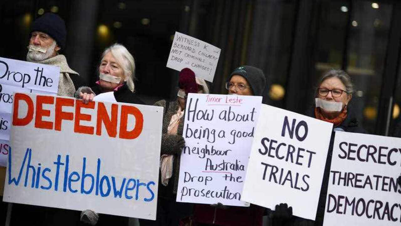 Supporters of lawyer Bernard Collaery and 'Witness K' stage a protest outside the Supreme Court.
