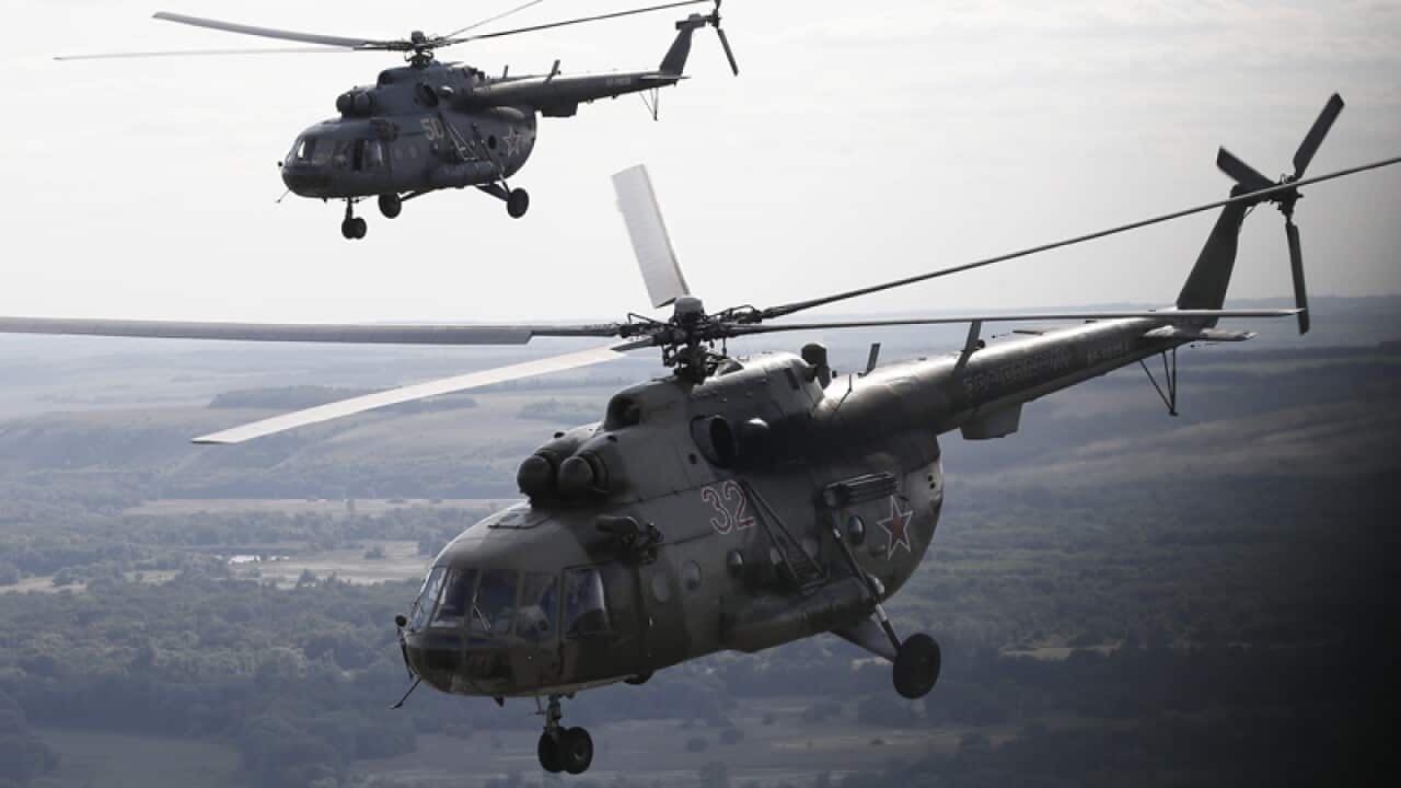 A file picture dated 07 August 2015 shows Russian Mi-8 helicopters