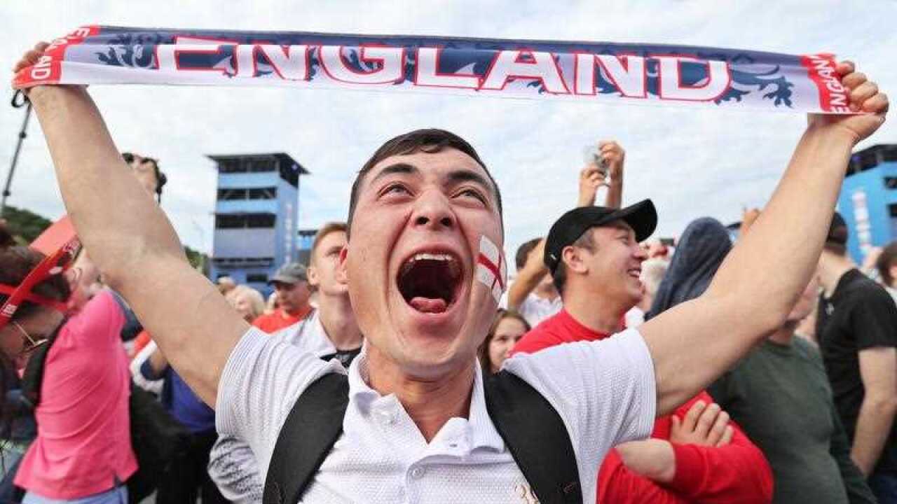An England fan celebrates his team scoring as he watches the FIFA World Cup 2018 quarter final match.