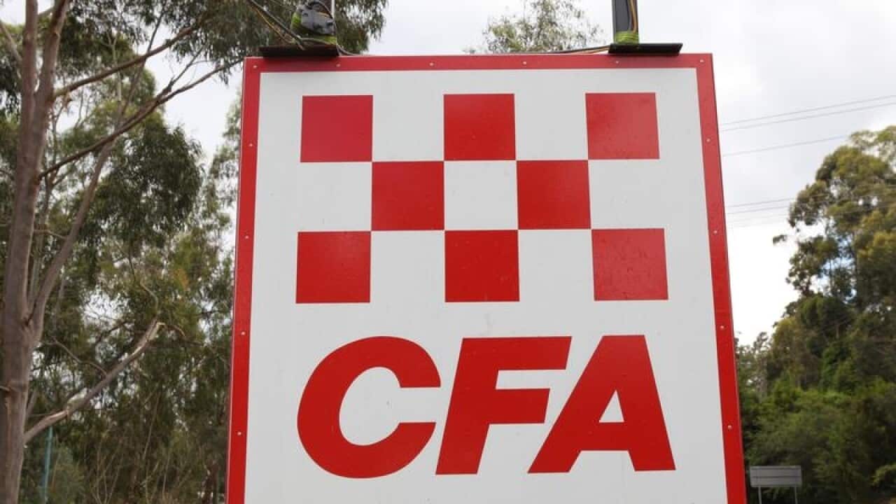 A Country Fire Authority (CFA) sign by a road.