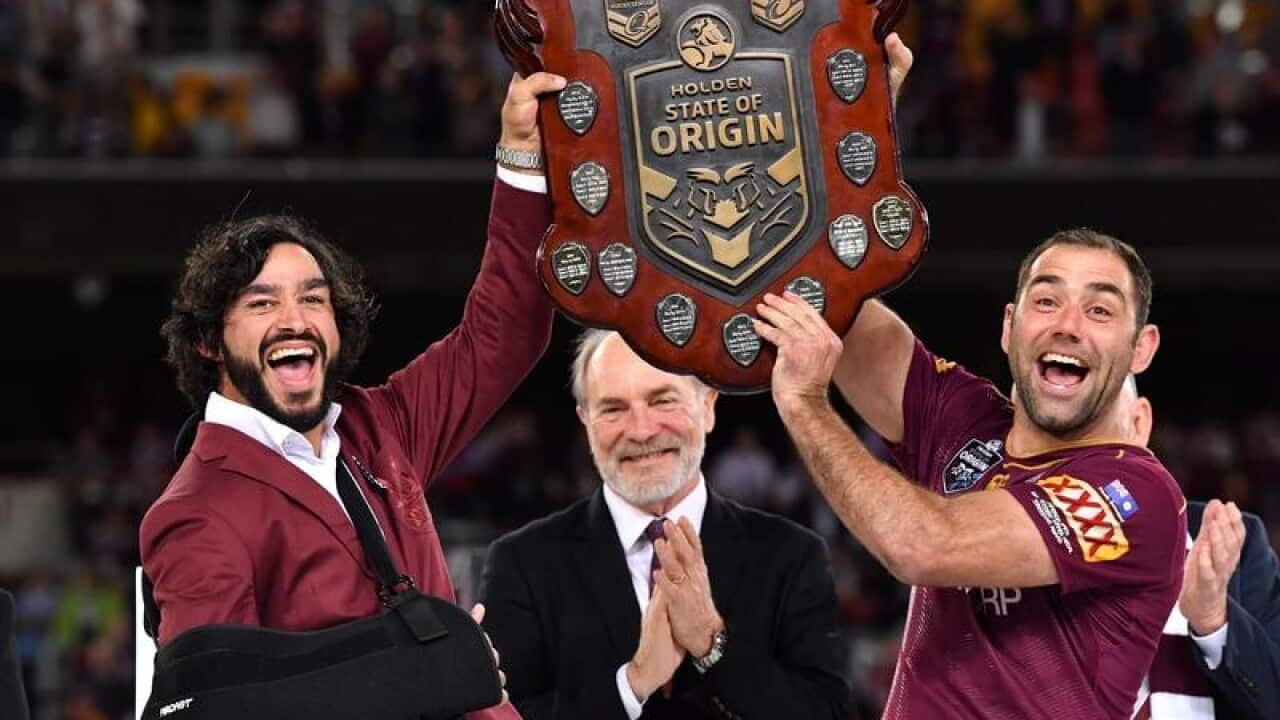 Johnathan Thurston and Cameron Smith of the Maroons celebrate