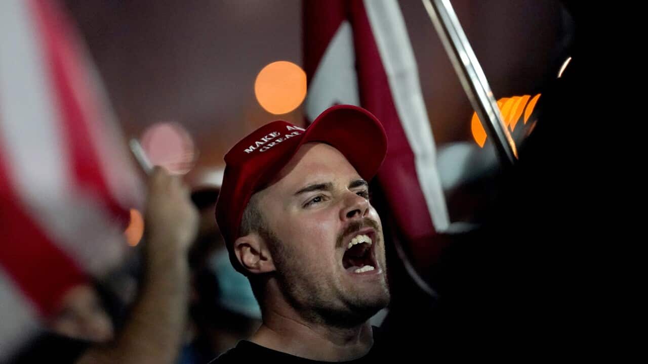 Supporters of President Donald Trump rally outside the Maricopa County Recorders Office, Wednesday, Nov. 4, 2020, in Phoenix. (AP Photo/Matt York)