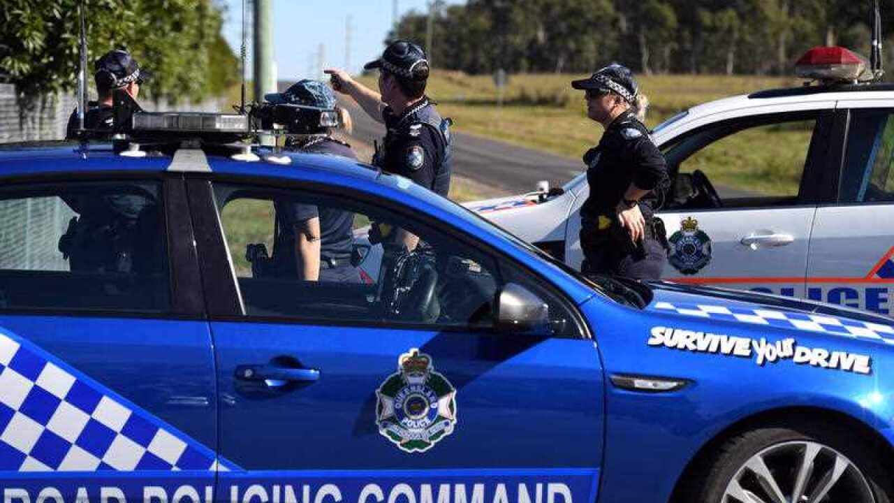 Police block a road close to the location of incident.