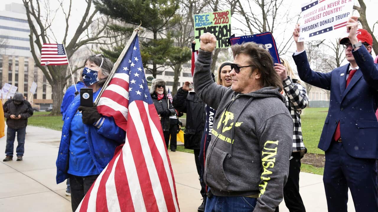 Rallygoers protest against Michigan Gov Gretchen Whitmer's stay-at-home order Wednesday, April 15, 2020.